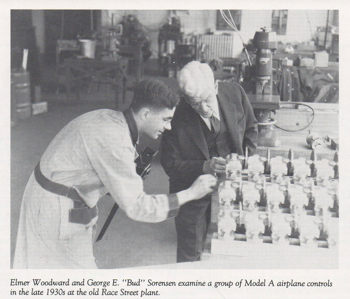 Elmer Woodward and his airplane engine governosr ready for shipment.