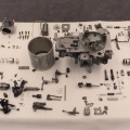 Components on display of a Woodward manufactured GE CF6-80C series jet engine fuel control (MEC).