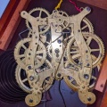 An 1886 brass clock gear set.