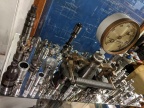 In the center is the Woodward Governor Company's largest made speeder spring flyweight part that go into their PMG control.