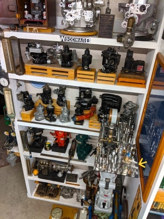 Showing the smallest Woodward type 2419 gas turbine engine governor ever manufactured (yellow arrow).