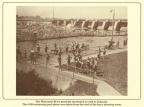 The Consolidated Water Power & Paper Company dam in the background.