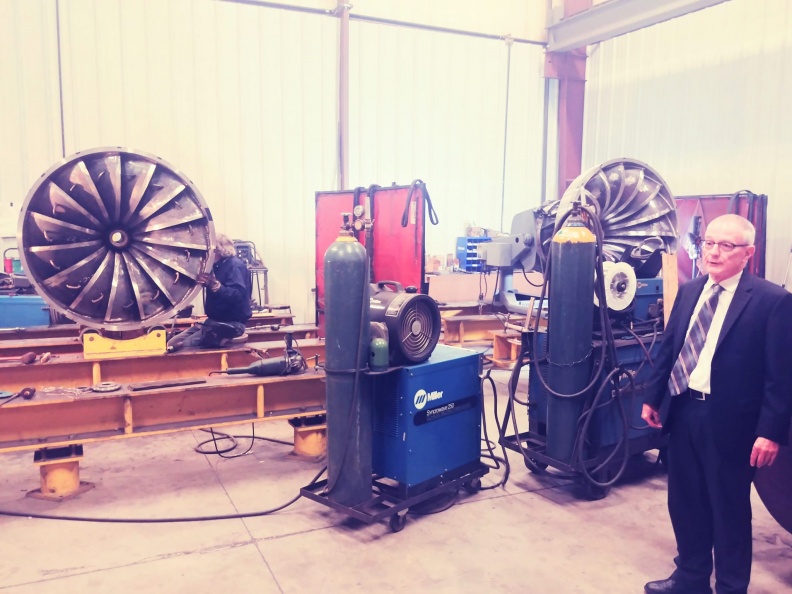 William Owens giving a tour on the James Leffel & Company's shop floor. 
