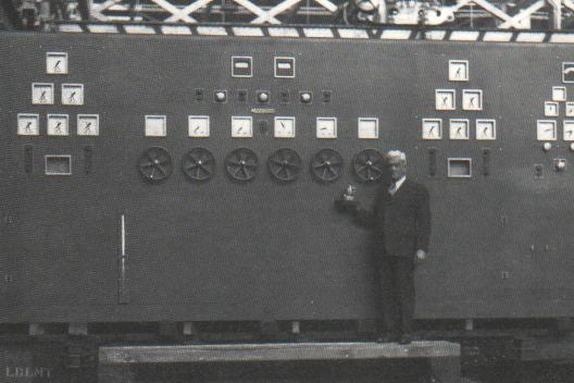 Elmer Woodward compares the smallest and the largest Woodward Governors manufactured   Circa 1937 